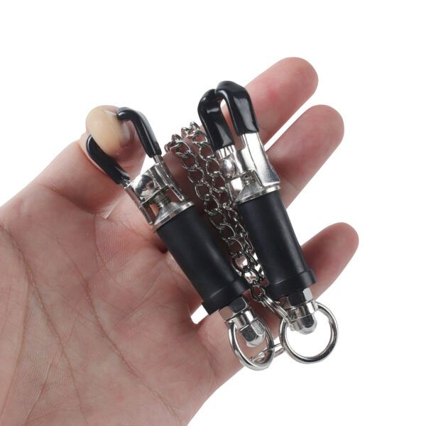 Banoch   Pinces de D.   Tepelklem   verstelbaar   zwart om vinger geklemd