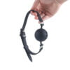 Banoch   ballgag siliconen large   zwart Ø 5 cm hangend in hand