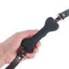 Banoch   mouth gag bone   siliconen gag bot   zwart   hondenbot   vastgehouden in hand