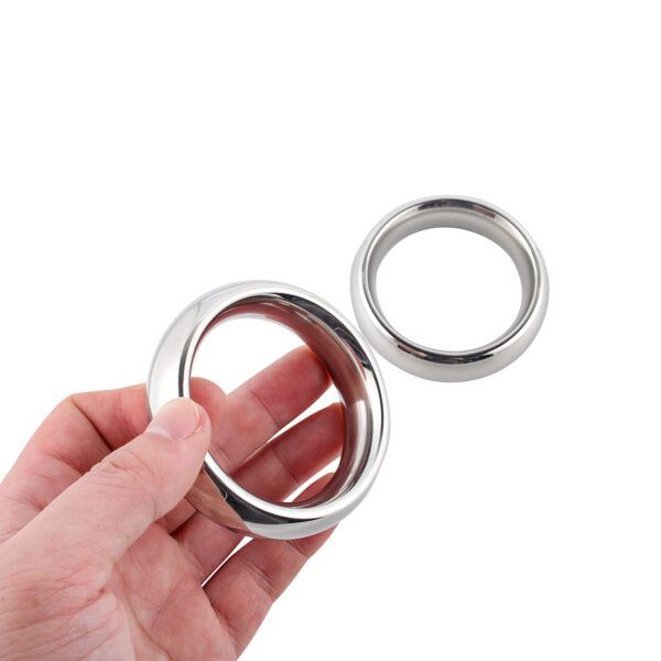 Banoch donut cockring in hand Banoch donut cockring in hand