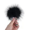 Banoch Tantra feather black zwarte streelveer in hand