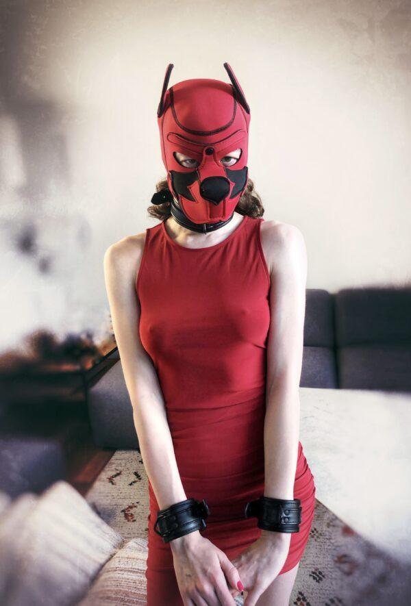 Banoch human puppy play model Darvinetta woman wearing red dress black cuffs and red neoprene dog mask scaled
